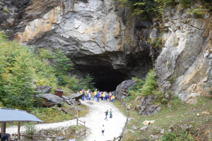 A group of people in front of an old mine