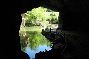 From inside the mine, looking out towards water and a path