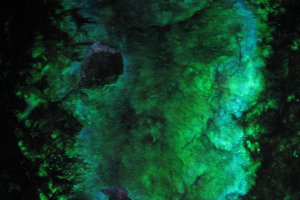 A closeup of vivid green and blue minerals