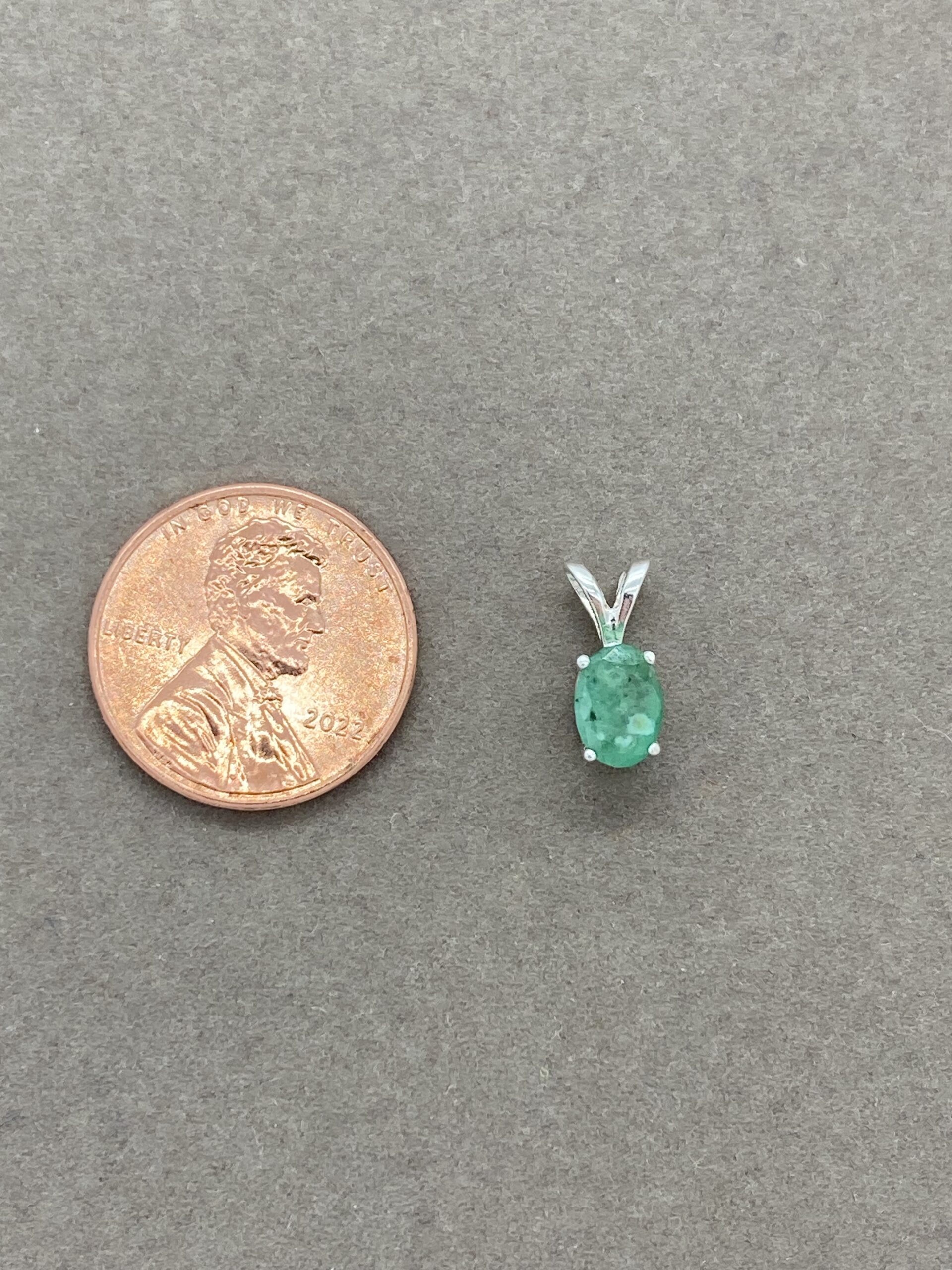 Emerald pendant with penny